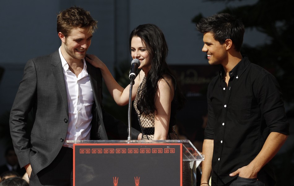 Actors Robert Pattinson left, Kristen Stewart and Taylor Lautner attend their hand and footprint ceremony at the Grauman039s Chinese Theatre in Hollywood, California November 3, 2011.