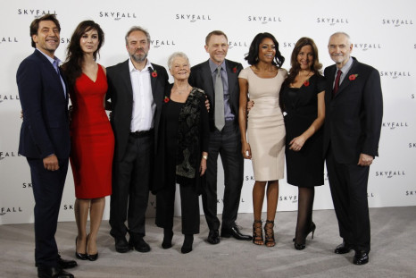 Director Sam Mendes (3rd L) poses with cast members (L-R) Javier Bardem, Berenice Marlohe, Judi Dench, Daniel Craig and Naomie Harris along with producers Barbara Broccoli and Michael G. Wilson during a photocall to launch the start of production of the n