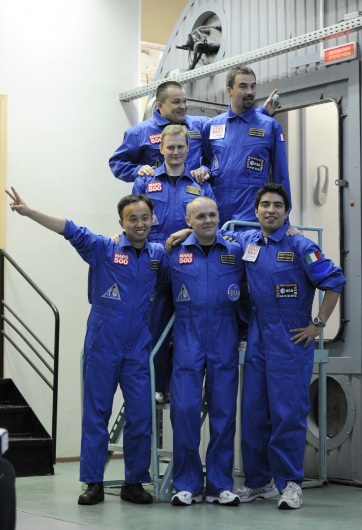 Participants of the Mars500 experiment, pose for a picture before entering a confinement module to start their mission in Moscow