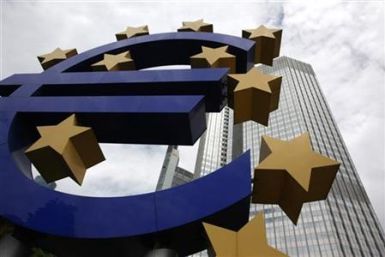 A huge euro logo stands in front of the headquarters of the European Central Bank in Frankfurt