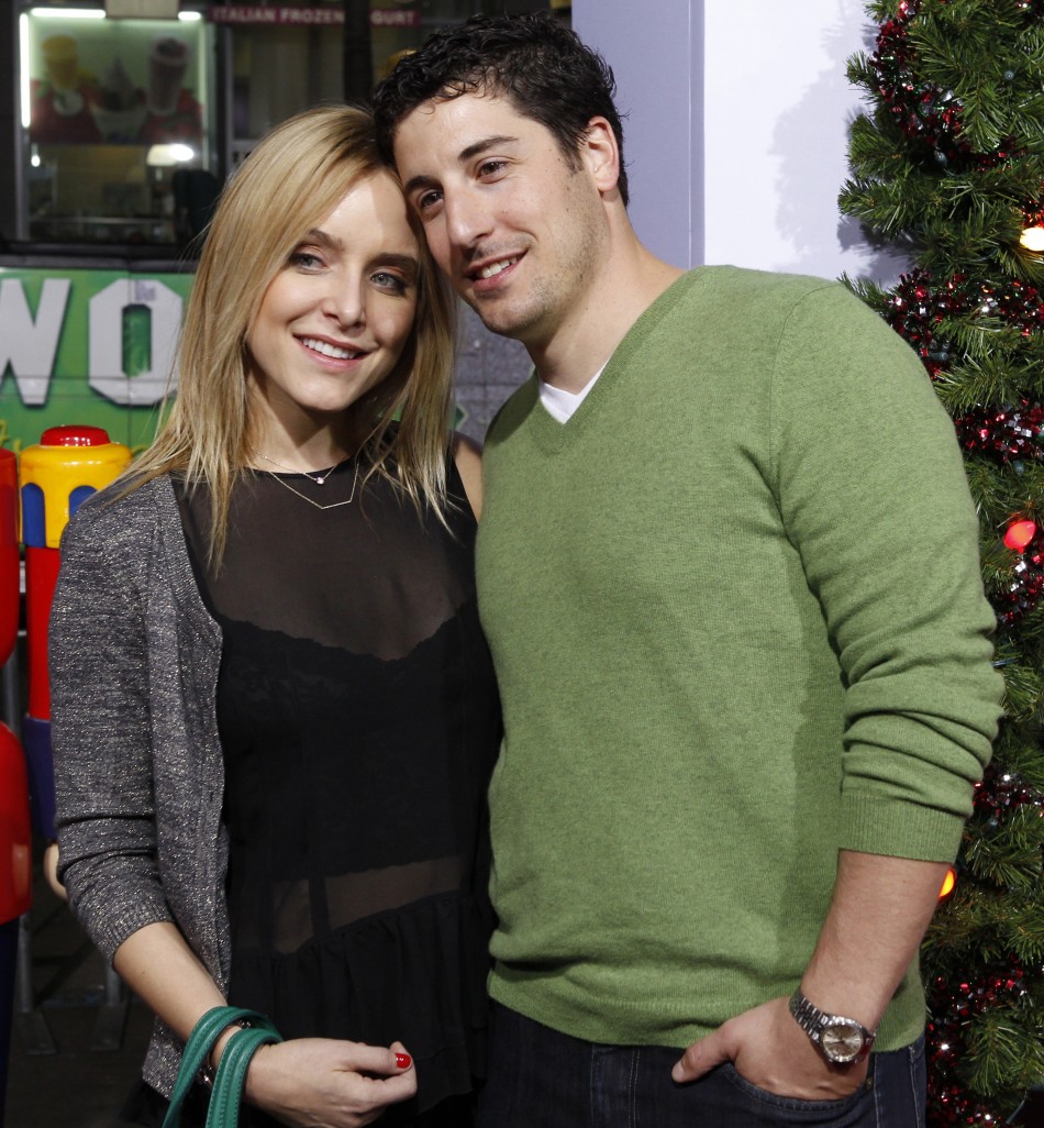 Actor Jason Biggs and wife Jenny Mollen pose at the premiere of the new film quotA Very Harold  Kumar 3D Christmasquot in Hollywood