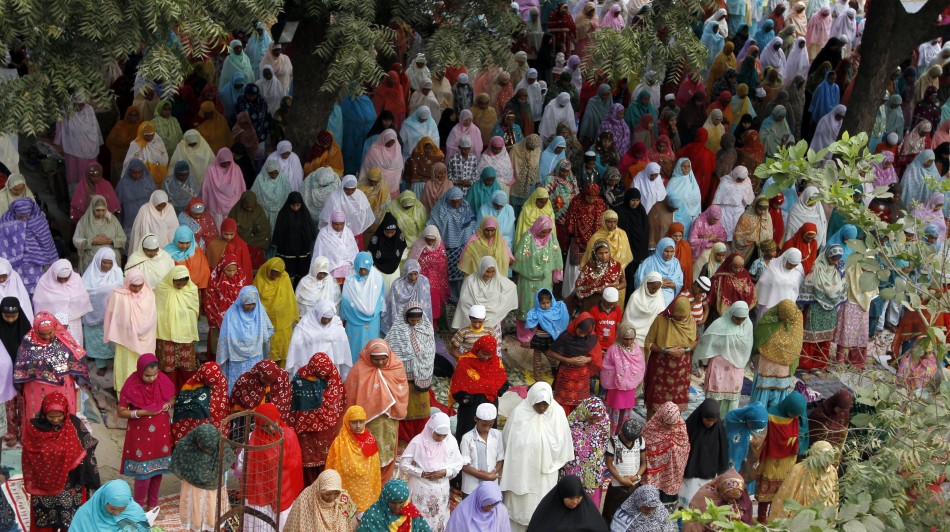 Muslim women offer prayers at a mosque on the eve of the Eid al-Adha festival on the outskirts of the western Indian city of Ahmedabad