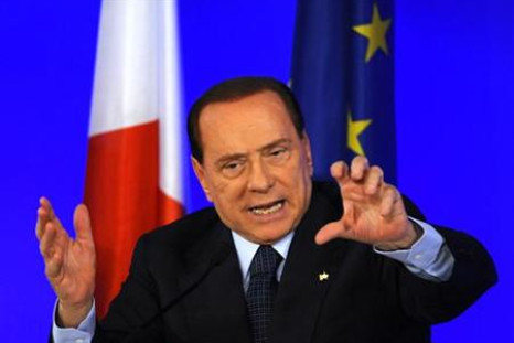 Italy's Prime Minister Berlusconi gestures during a news conference at the end of the G20 Summit in Cannes