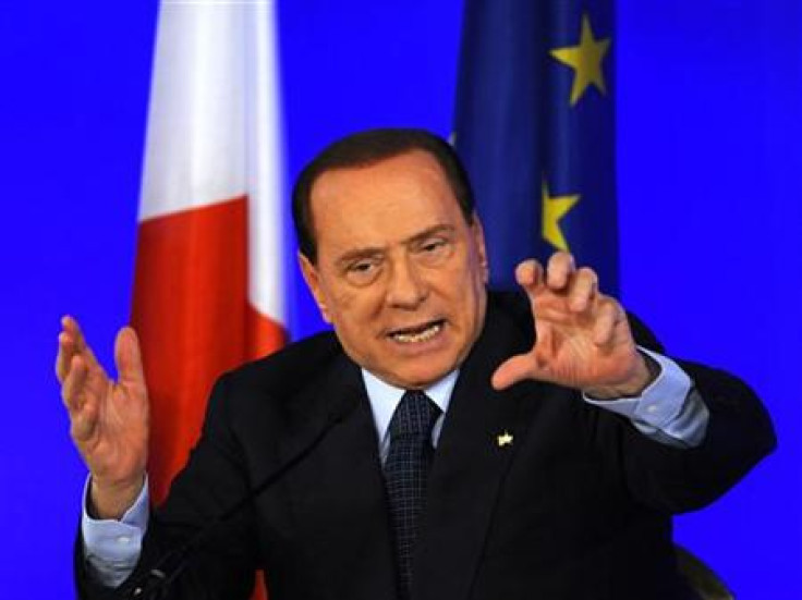 Italy&#039;s Prime Minister Berlusconi gestures during a news conference at the end of the G20 Summit in Cannes