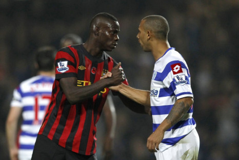 Queens Park Rangers' Anton Ferdinand shakes hands with Manchester City's Mario Balotelli after their English Premier League soccer match in London
