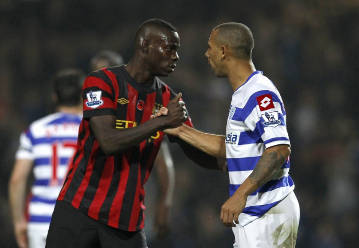 Queens Park Rangers' Anton Ferdinand shakes hands with Manchester City's Mario Balotelli after their English Premier League soccer match in London