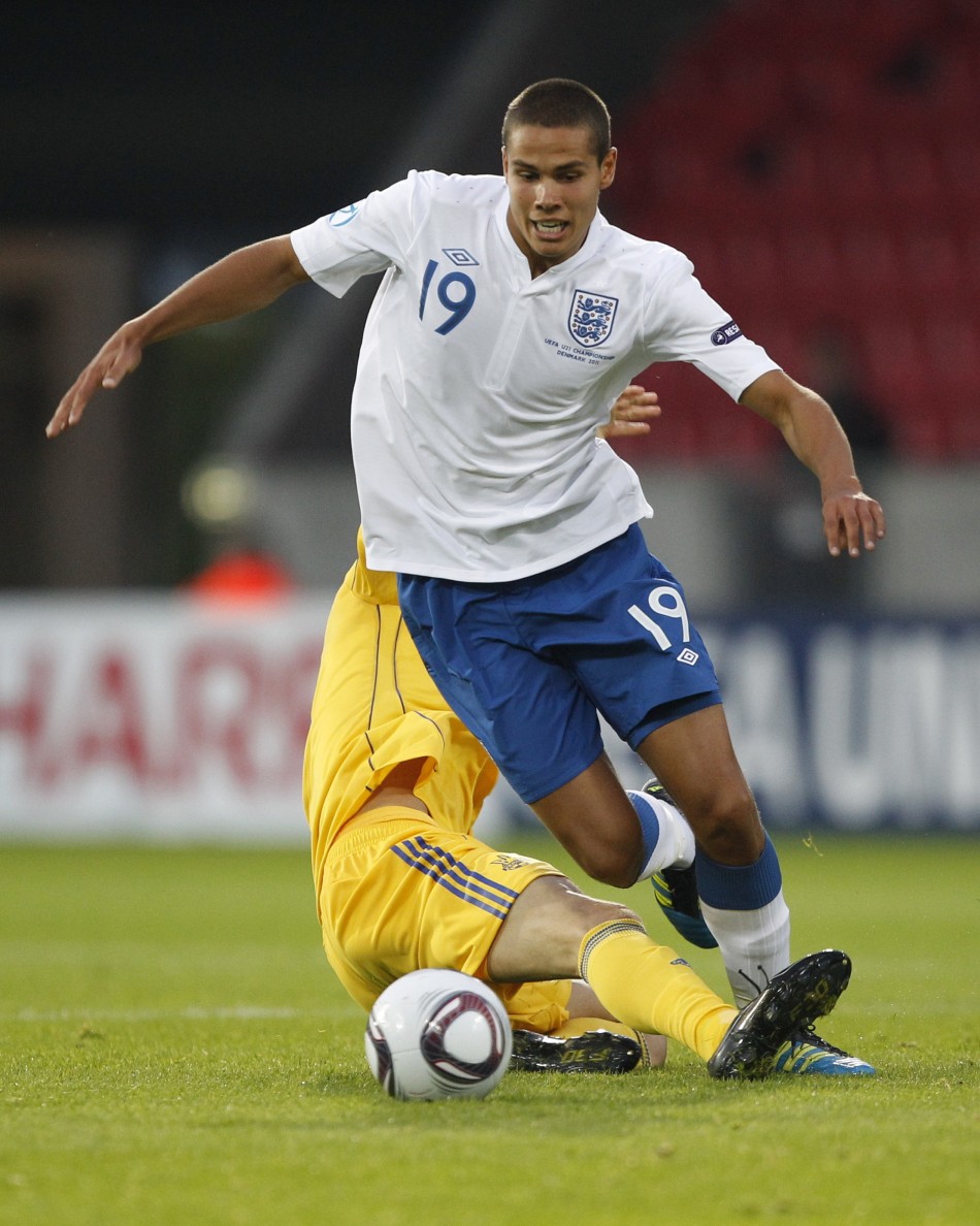 Ukraines Denys Garmash challenges Englands Jack Rodwell during their European Under-21 Championship soccer match in Herning
