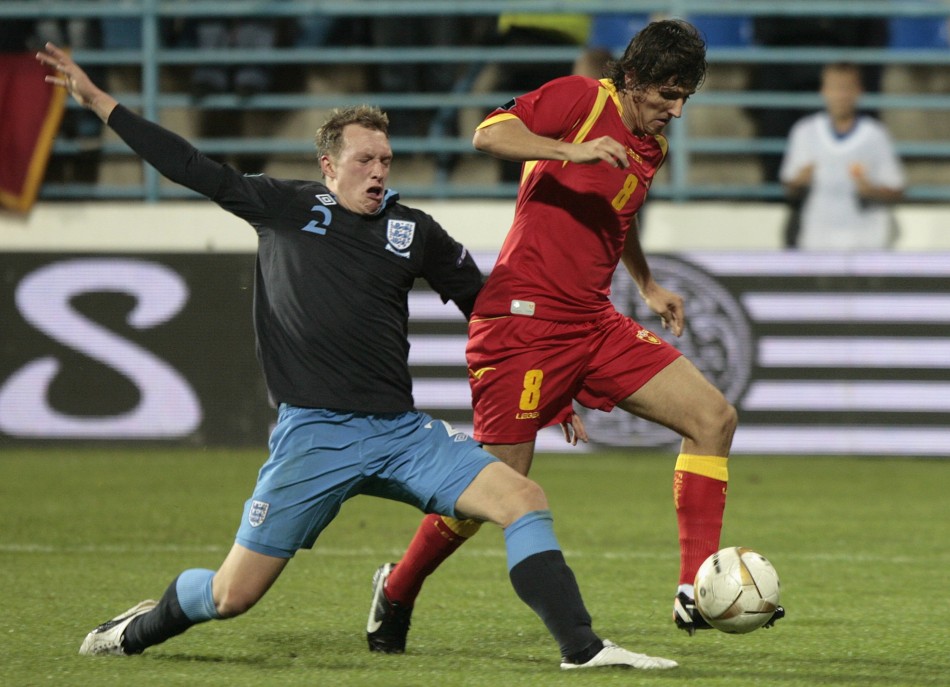 Englands Jones challenges Montenegros Jovetic during their Euro 2012 Group G qualifying soccer match in Podgorica