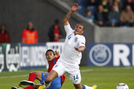 England's Kyle Walker is fouled by Spain's Thiago Alcantara during their European Under-21 Championship soccer match in Herning