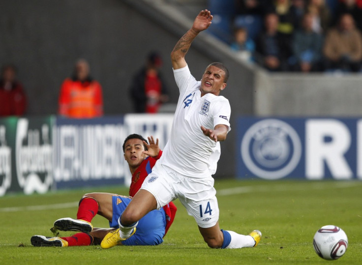 England's Kyle Walker is fouled by Spain's Thiago Alcantara during their European Under-21 Championship soccer match in Herning