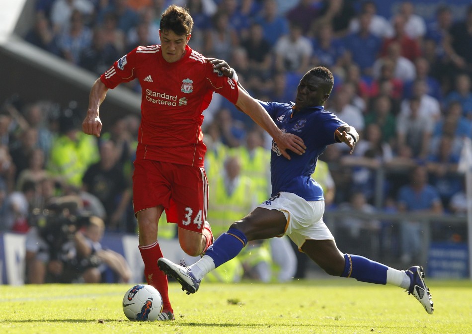 Evertons Drenthe challenges Liverpools Kelly during their English Premier League soccer match in Liverpool