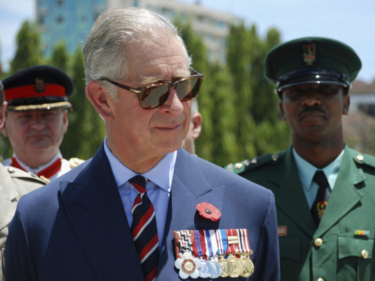 Britain's Prince Charles listens to members of TPDF after a parade in Dar es Salaam