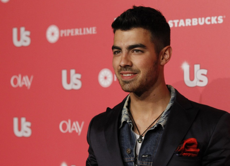 Jonas poses at the US Weekly Hot Hollywood Style issue party in Hollywood