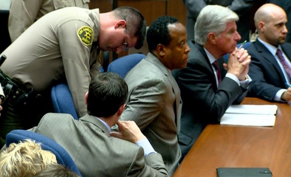 Dr. Conrad Murray is handcuffed as he is remanded into custody