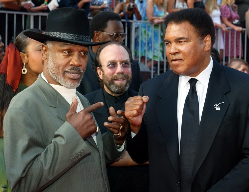 Boxers Joe Frazier L and Muhammad Ali pose together as they arrive at the 10th annual ESPY Awards in 2002.