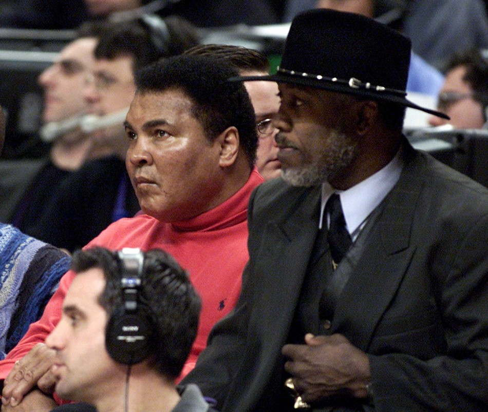 Muhammad Ali L and Joe Frazier watch the 2002 NBA All-Star game at the First Union Center in Philadelphia.