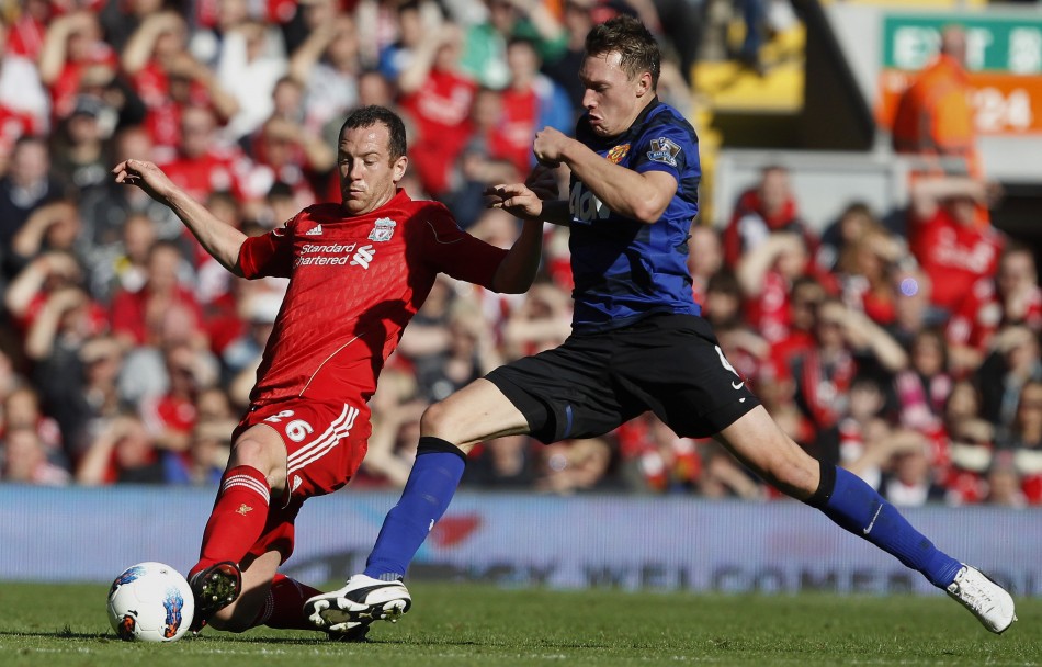Liverpools Adam challenges Manchester Uniteds Jones during their English Premier League soccer match at Anfield in Liverpool 15102011