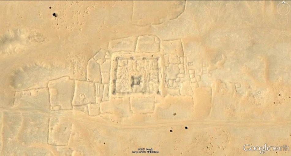 Satellite image of area of desert with archaeological interpretation of features fortified village, cairn cemeteries and oasis gardens.