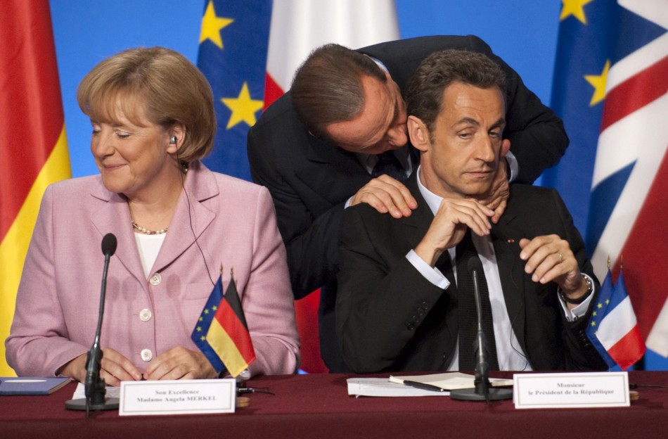 Belusconi massaging a tensed Sarkozy