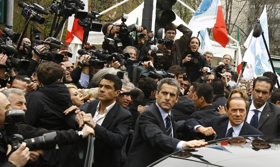Italys Prime Minister Silvio Berlusconi leaves the Justice Palace in Milan
