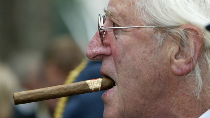 Sir Jimmy Savile arrives at the unveiling of a new Battle of Britain monument in central London