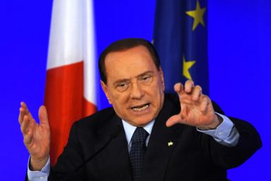 Italy's Prime Minister Berlusconi gestures during a news conference at the end of the G20 Summit in Cannes