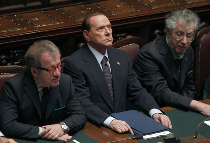 Italian Prime Minister Berlusconi looks on next Justice Minister Maroni and League North Party leader Bossi during a finance vote at the parliament in Rome