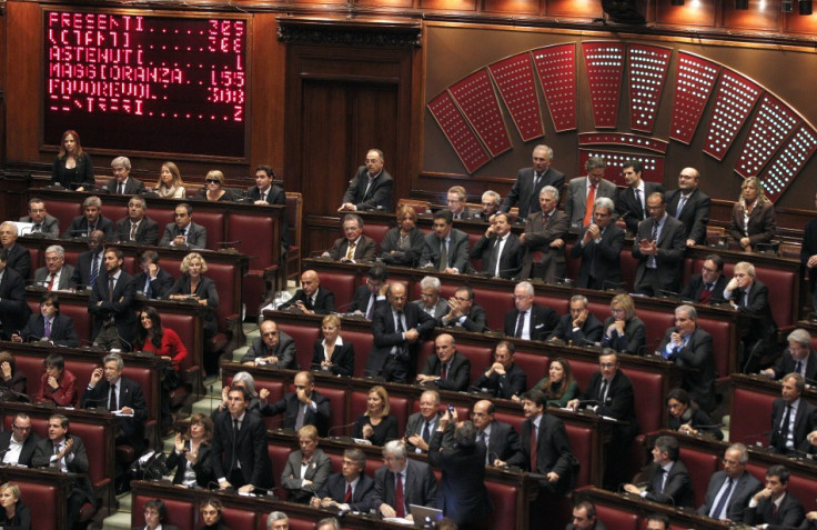 A billboard displays the results during a finance vote at the parliament in Rome