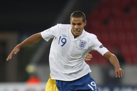 Ukraine's Denys Garmash challenges England's Jack Rodwell during their European Under-21 Championship soccer match in Herning
