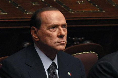 Italian PM Berlusconi looks on during a finance vote at the parliament in Rome
