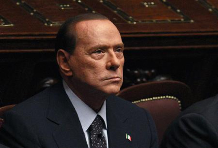 Italian PM Berlusconi looks on during a finance vote at the parliament in Rome