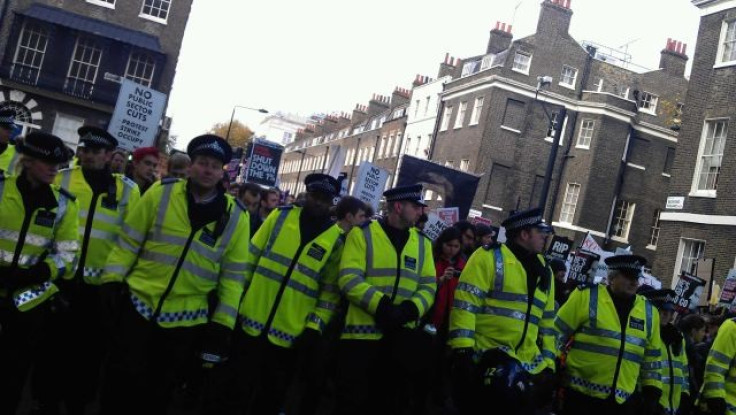 Police line with student protesters