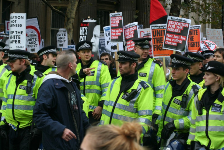 Police officer and protester stare at each other