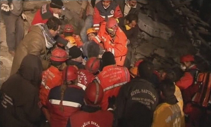 Rescuers assist earthquake survivor Konnai after earthquake south of the city of Van