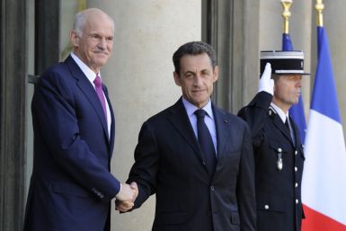 France's President Sarkozy greets Greek Prime Minister Papandreou on the steps of the Elysee Palace in Paris