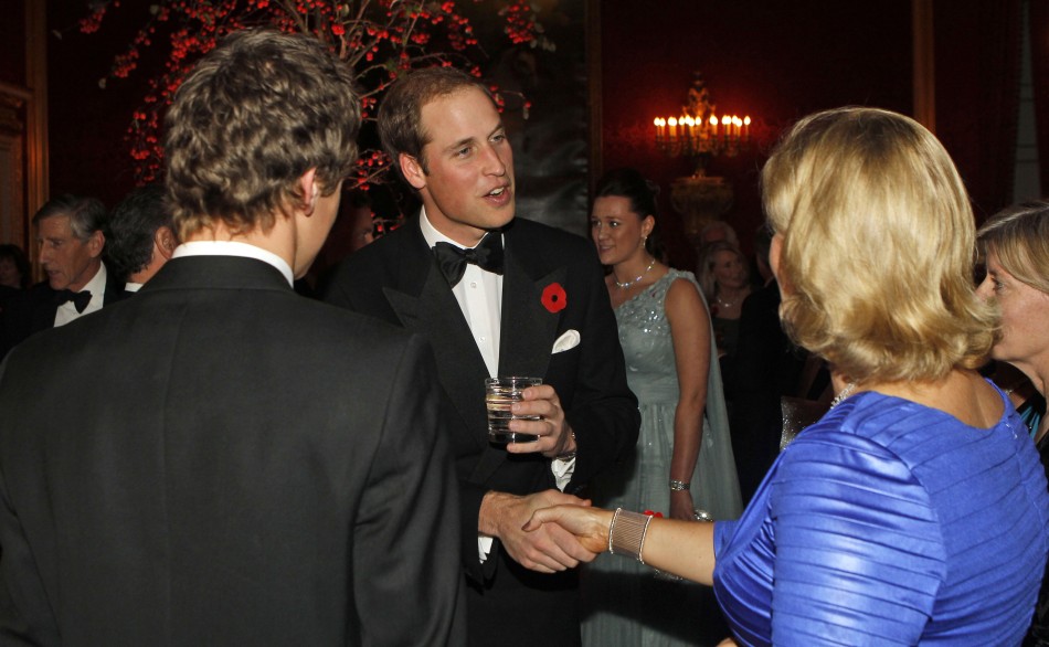 William greets a lady at the event