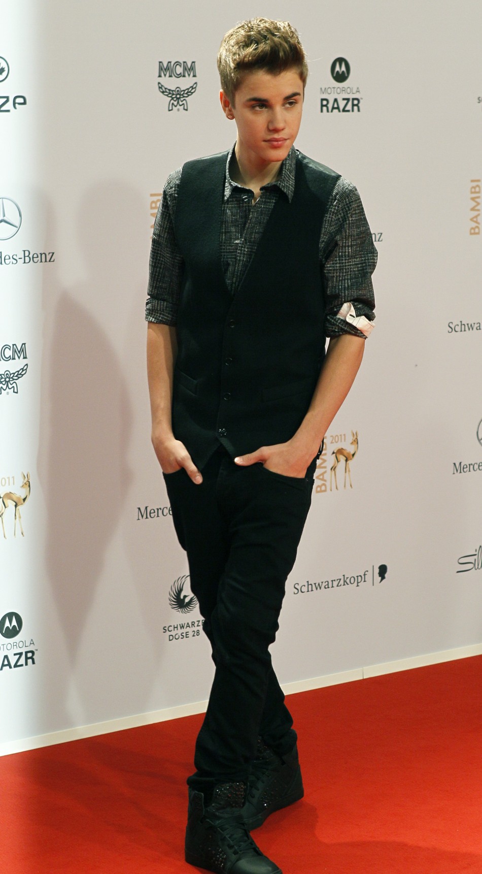 Canadian singer Justin Bieber arrives on the red carpet for the 63rd Bambi media awards ceremony in Wiesbaden