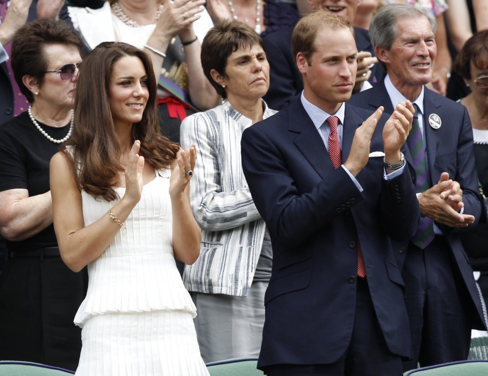 Britains Prince William and his wife, Catherine, Duchess of Cambridge applaud after Andy Murray of Britain defeated Richard Gasquet of France, on Centre Court at the Wimbledon tennis championships in London
