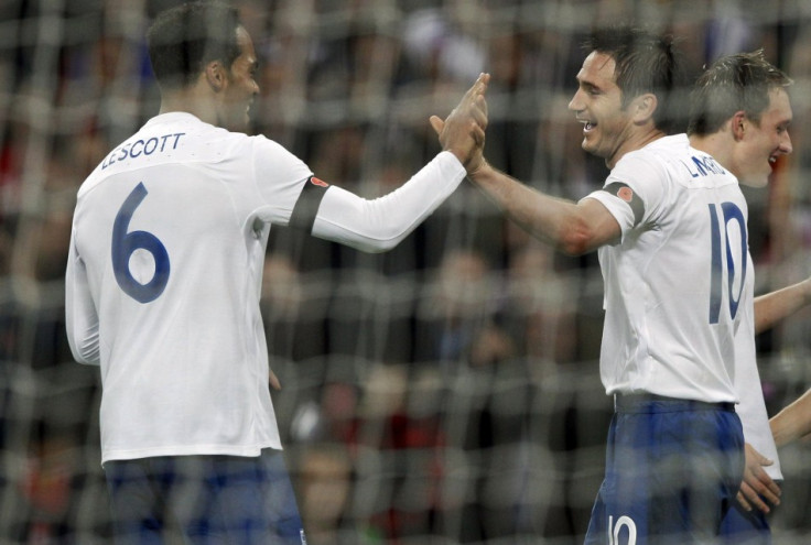 England&#039;s Frank Lampard (R) is congratulated by teammate Joleon Lescott after scoring a goal against Spain during their international friendly soccer match at Wembley