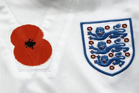 A remembrance day poppy is seen on the training top of England's Scott Parker before his international friendly soccer match against Spain in London