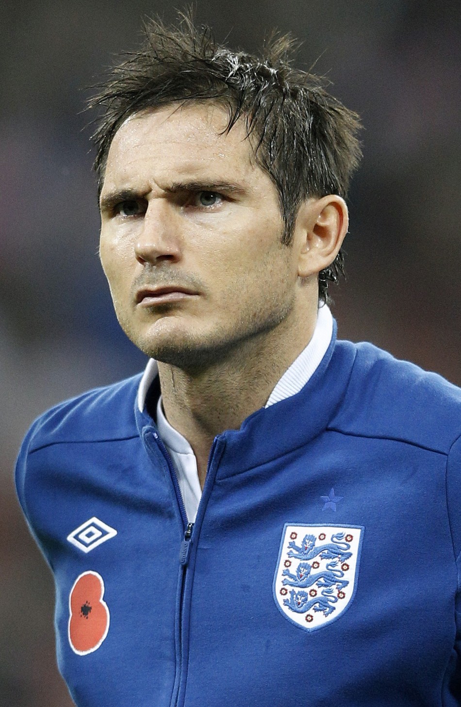 Englands Lampard lines up for the national anthems before their international friendly soccer match against Spain at Wembley Stadium in London
