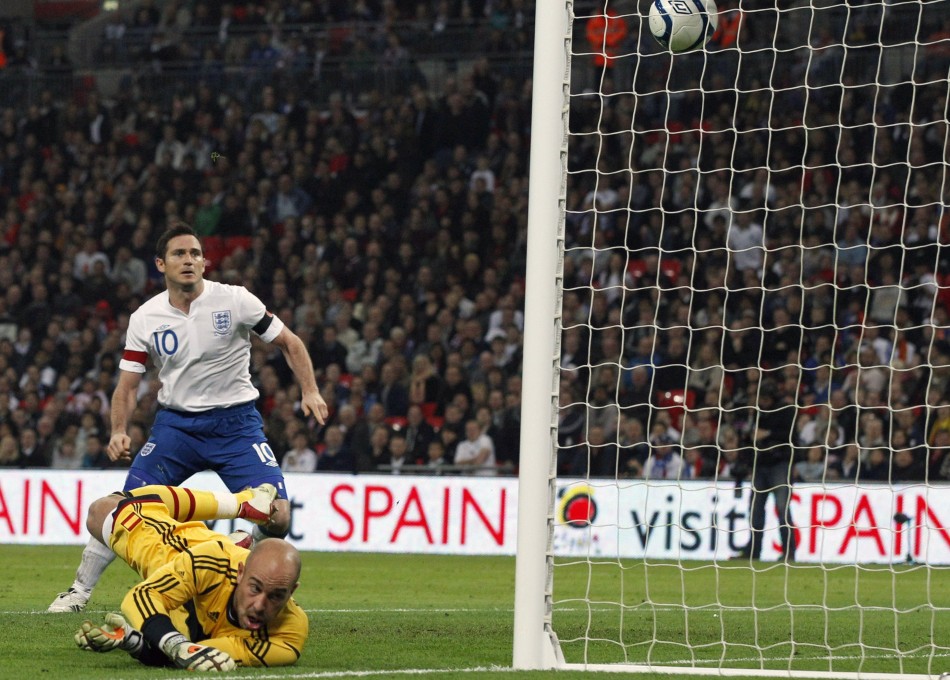 Spains Reina dives for the ball as it bounces out to Englands Lampard to score a goal during their international friendly soccer match at Wembley Stadium in London