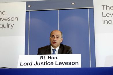 Lord Justice Brian Leveson speaks at the inquiry into alleged phone hacking by the British media, at the Queen Elizabeth II Conference Centre in London