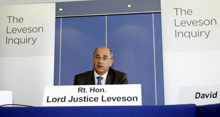 Lord Justice Brian Leveson speaks at the inquiry into alleged phone hacking by the British media, at the Queen Elizabeth II Conference Centre in London