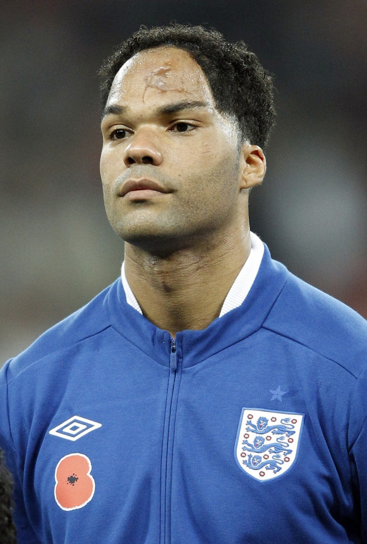 England&#039;s Joleon Lescott lines up for the national anthems before their international friendly soccer match against Spain at Wembley