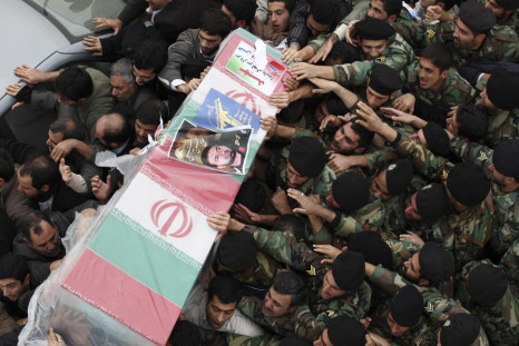 Iranian policemen carry coffin of Tehrani Moghadam, Revolutionary guards commander, who was killed during blast in military base, in Tehran