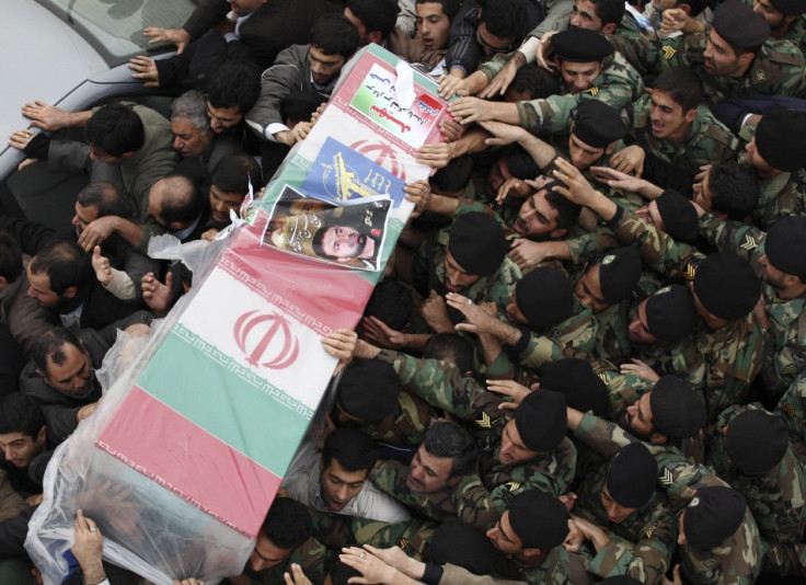 Iranian policemen carry coffin of Tehrani Moghadam, Revolutionary guards commander, who was killed during blast in military base, in Tehran