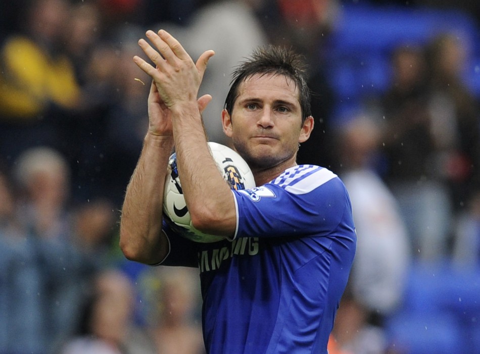 Chelseas Frank Lampard walks off with the match ball after their English Premier League soccer match against Bolton Wanderers in Bolton