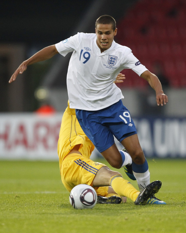 Ukraine's Denys Garmash challenges England's Jack Rodwell during their European Under-21 Championship soccer match in Herning