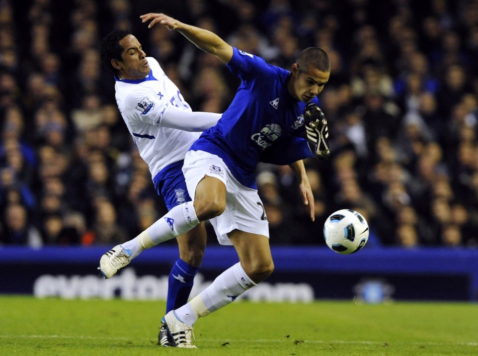 Birmingham Citys Beausejour challenges Evertons Rodwell during their English Premier League soccer match in Liverpool